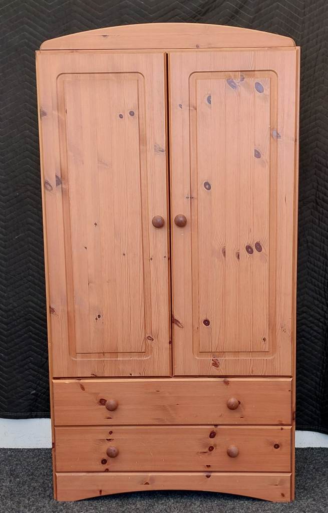 Solid pine childrens wardrobe.