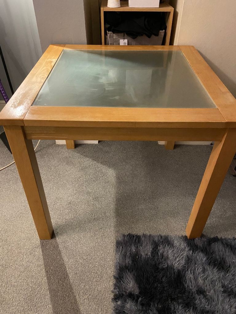 Wood dining table with glass top