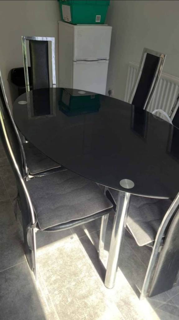 Black dining table with 6 chairs