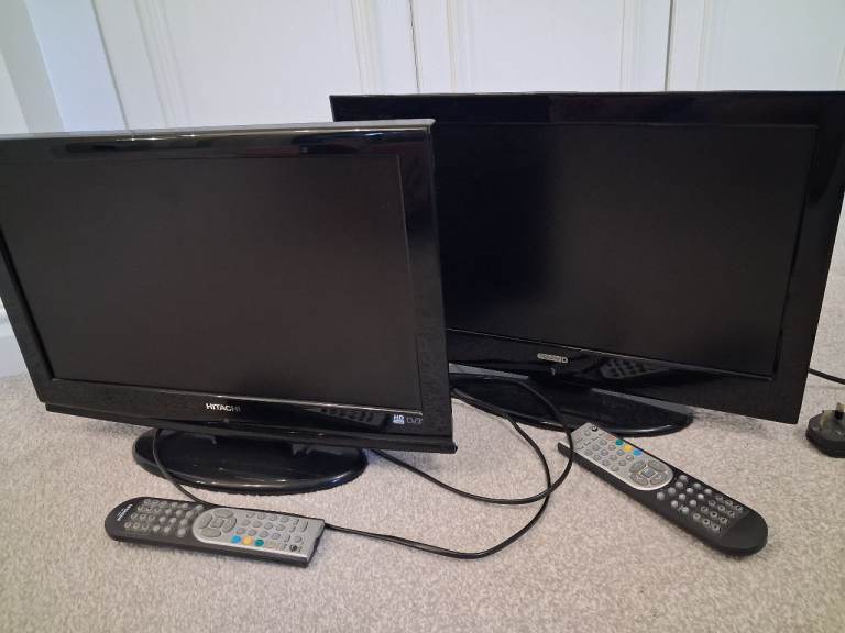 Two Black Flat Screen TVs with Remotes – Good Condition