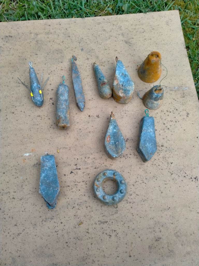 Job lot of eleven sea fishing lead weights 