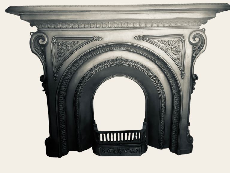 Antique rococo cast iron fireplace and inset .