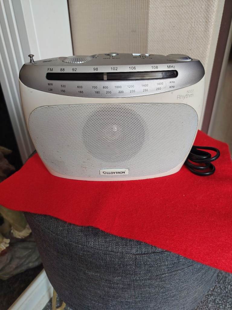 A LLOYTRON RHYTHM N322 FM/MW/LW PORTABLE RADIO WITH POWER LEAD. WORKS GREAT!