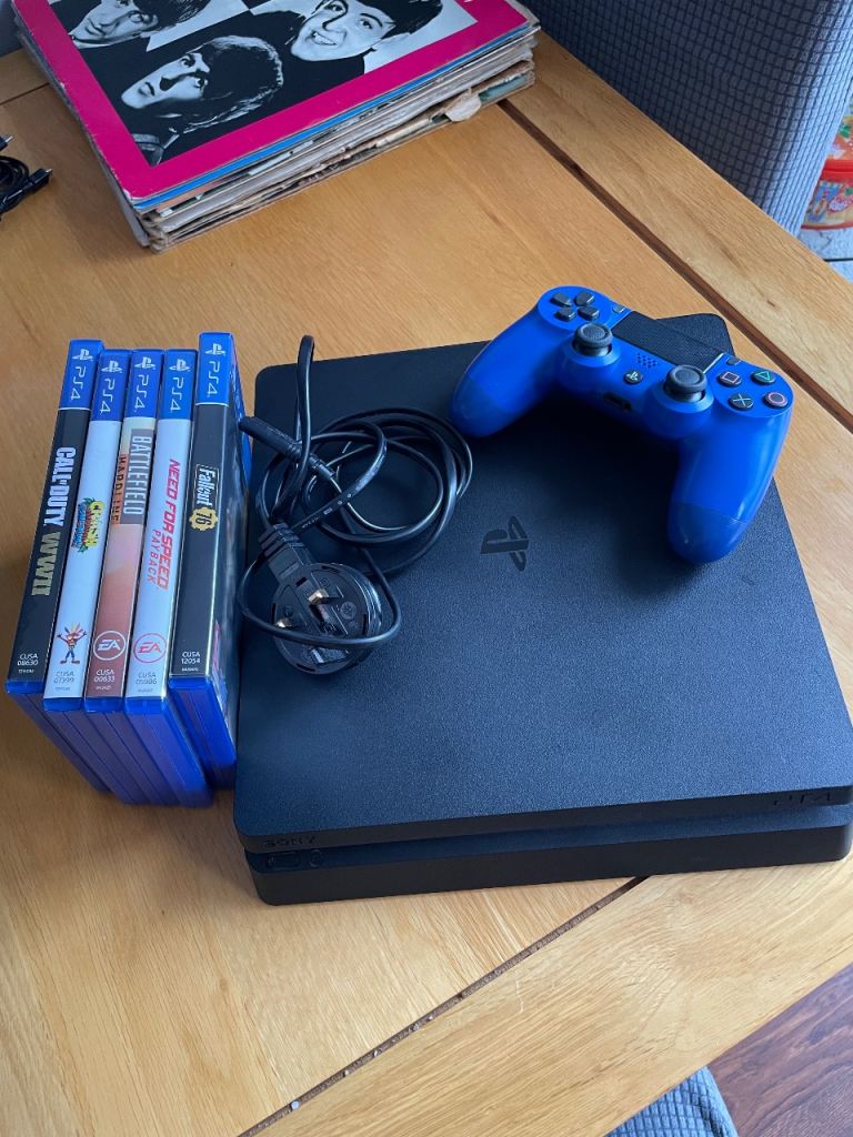 Sony PlayStation 4 Slim Console with Blue Controller and 5 Games