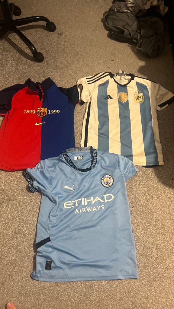 Football shirts Man City and Argentina and Barcelona