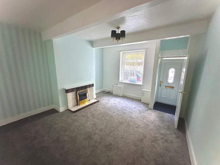 2 bed mid terraced in good condition with parking and a garden