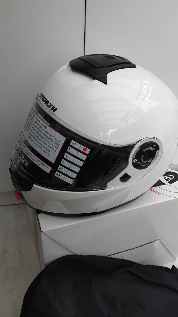 XS Motobike helmet flip up new never been used 