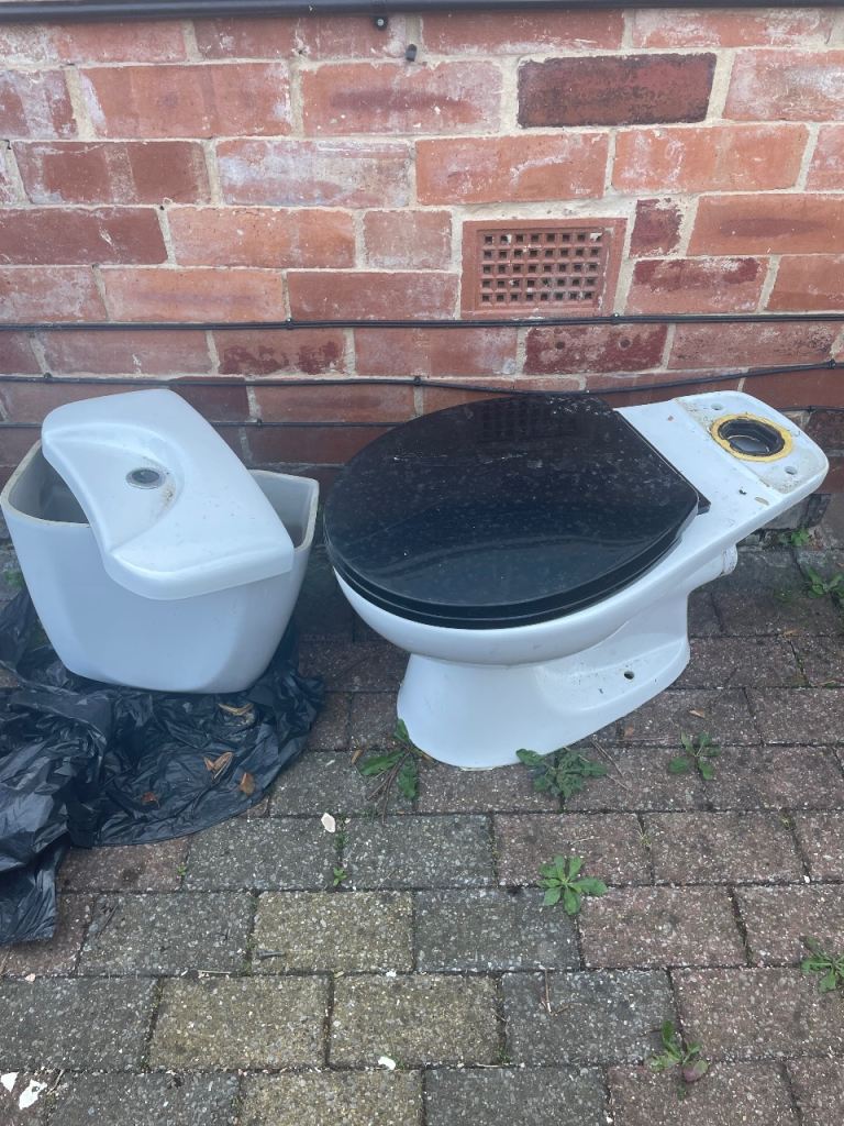 White Toilet with Black Seat and Cistern – Fair Condition