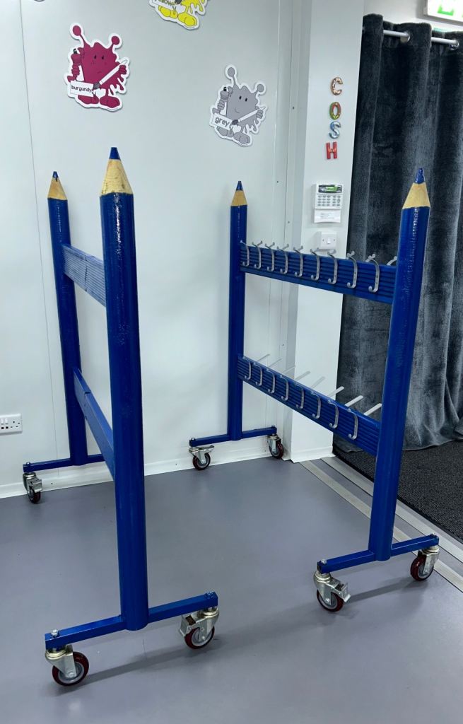 Blue Pencil-Shaped Coat Racks on Wheels – Good Condition sold separately or together