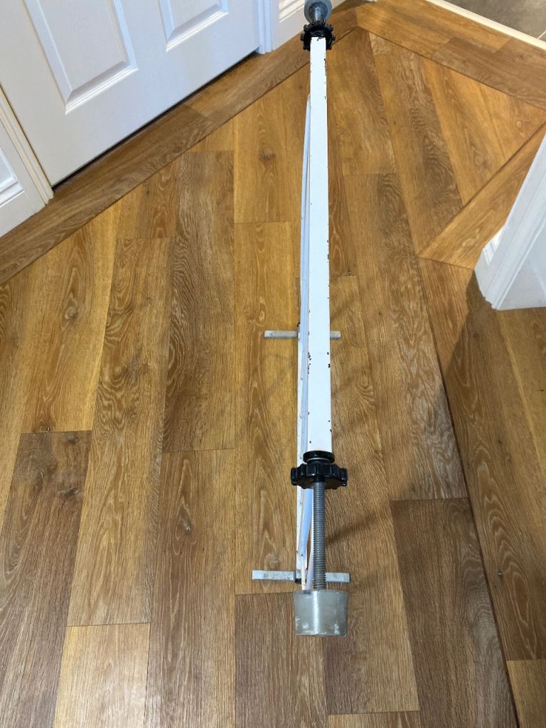 Safety gate with adjustable  locating screws