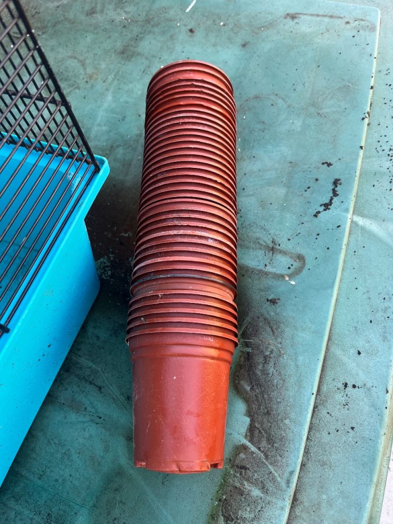 Stack of Brown Plastic Plant Pots – Good Condition