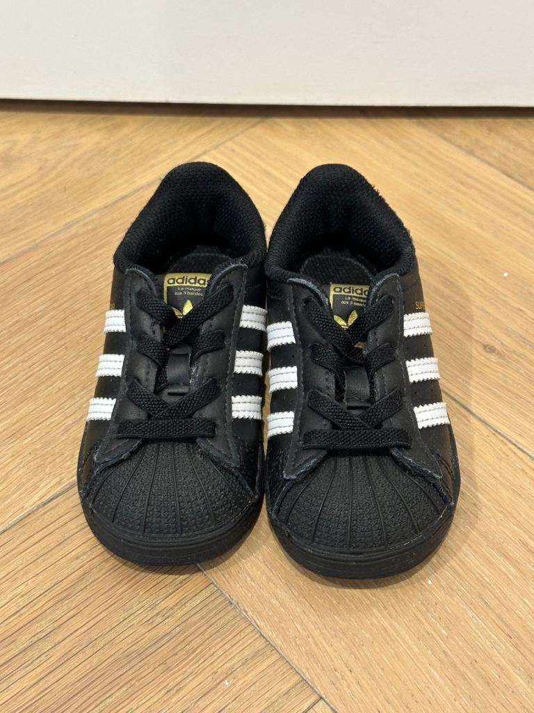 Adidas black slip-on sneakers
