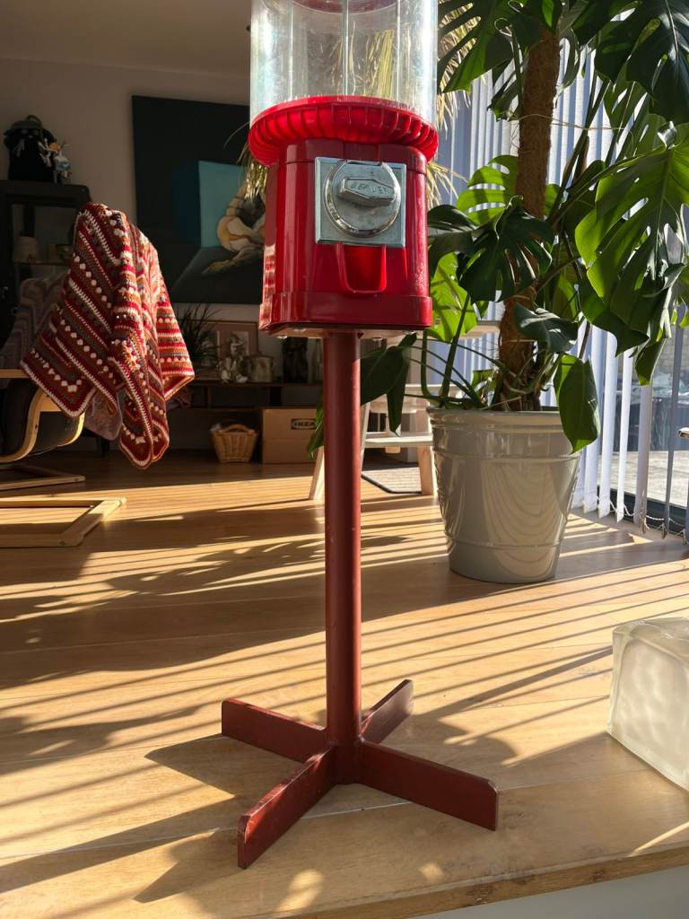 Beaver gum ball machine on stand