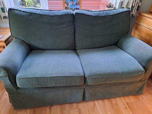 Comfortable Two-Seater Sofa Bed – Green Fabric, Good Condition