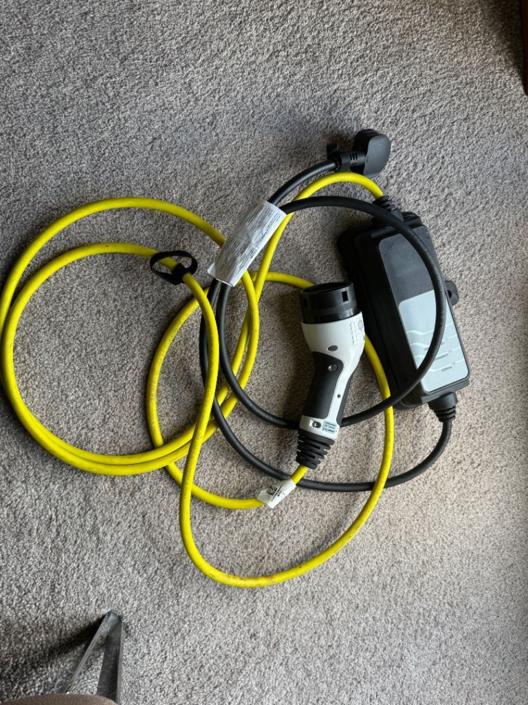 Electric vehicle mains charging adapter