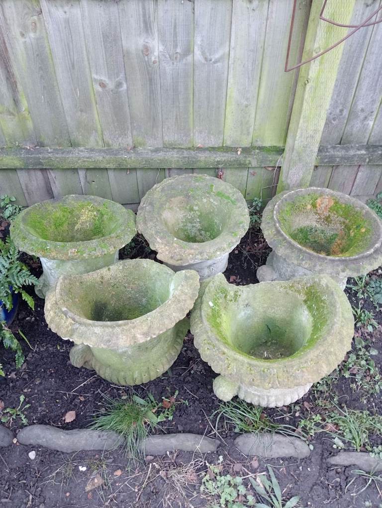 Rare antique stone planters with god heads on side urn plant pot