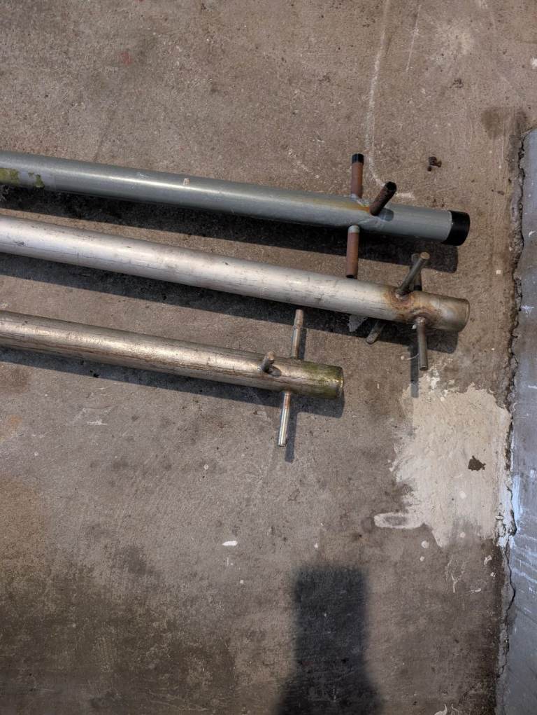 3 8ft clothes poles. 2 stainless steel + 1 galvanised steel