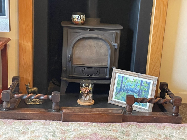 Antique oak fireplace fender with barley twist design 