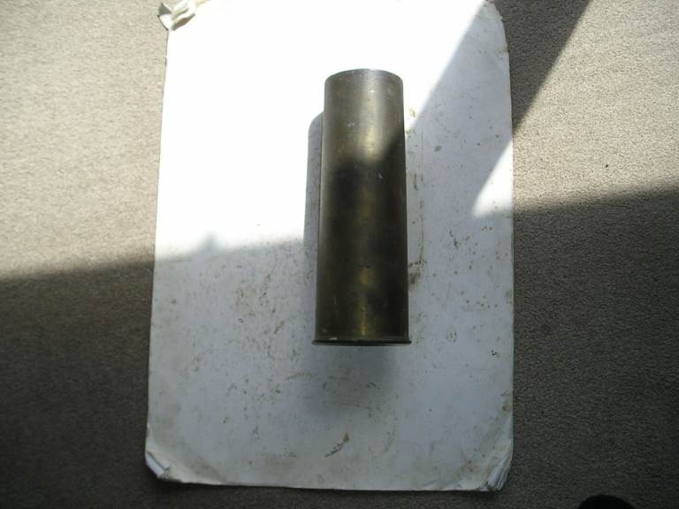 BRASS SHELL CASE, 1945.