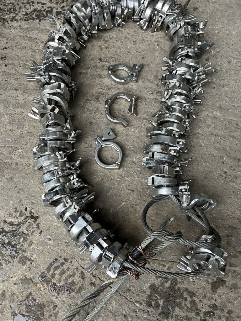 Approx 85 Tri Clover  type stainless steel quick release pipe clamps.