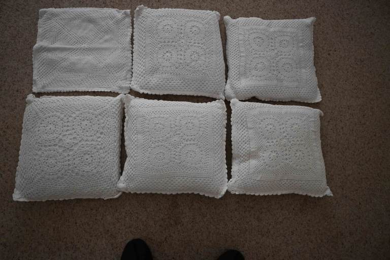6 white crochet cushions