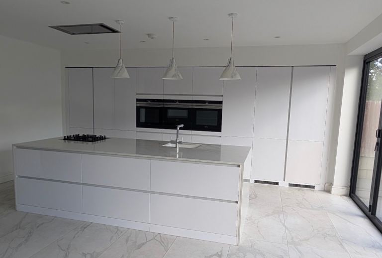Used Large Gloss White Handleless Kitchen with Quartz Island | in ...