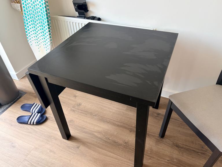 Expanding dining table and two chairs