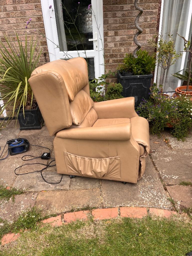 Pair of beige leather powered recliner armchairs 