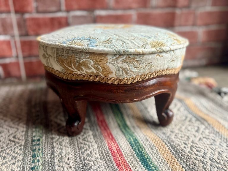 An Antique reupholstered footstools, Featuring round top, wooden fancy French style frame & feet,