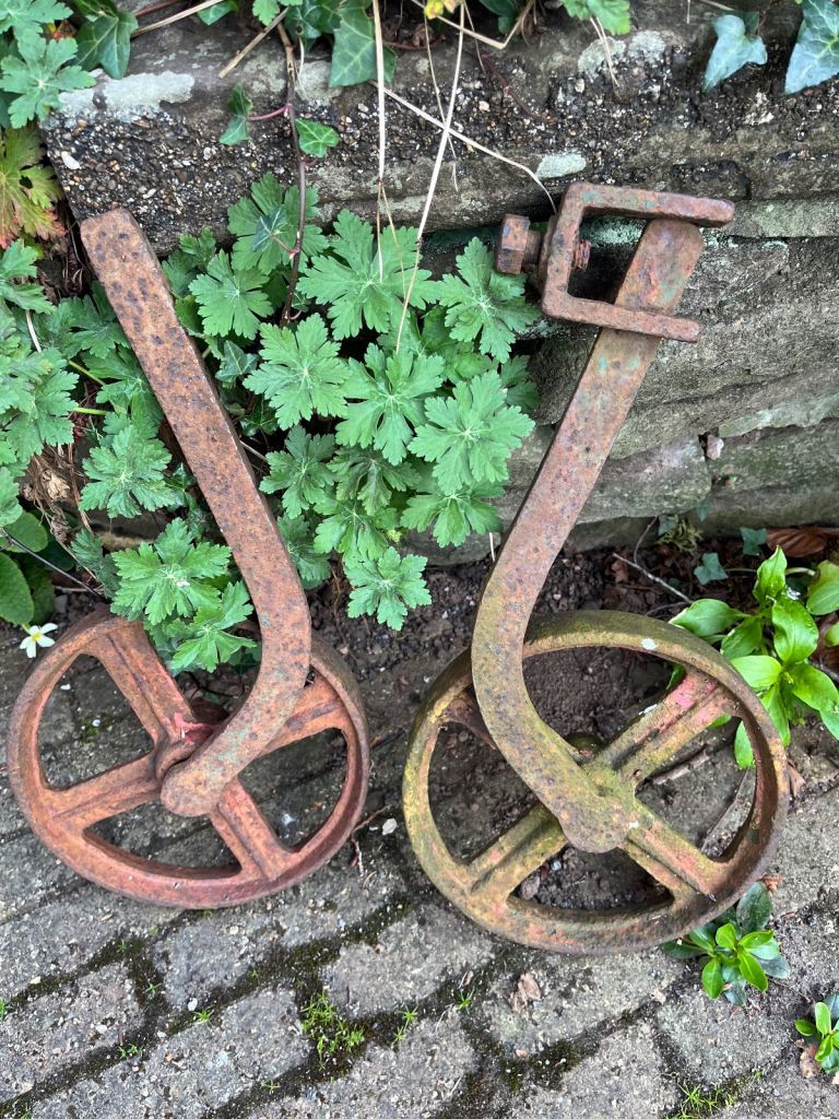 Two vintage iron metal wheels 