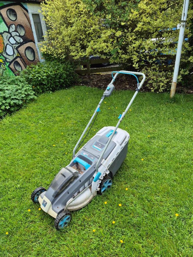 Electric lawn mower and charger and battery