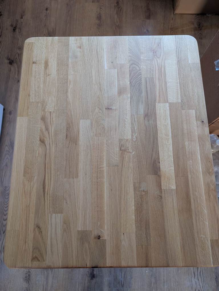 Solid Oak dinner table with cast iron base