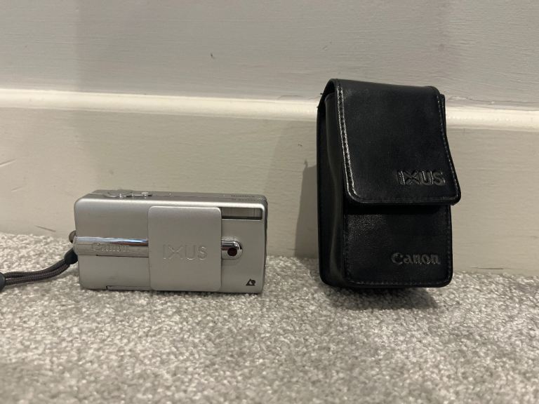 Vintage silver Canon IXUS III compact film camera.