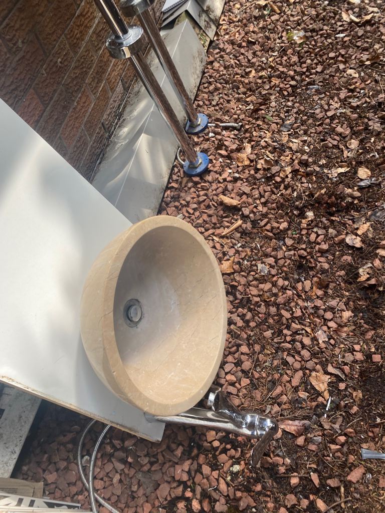 Solid stone countertop sink and tall tap 