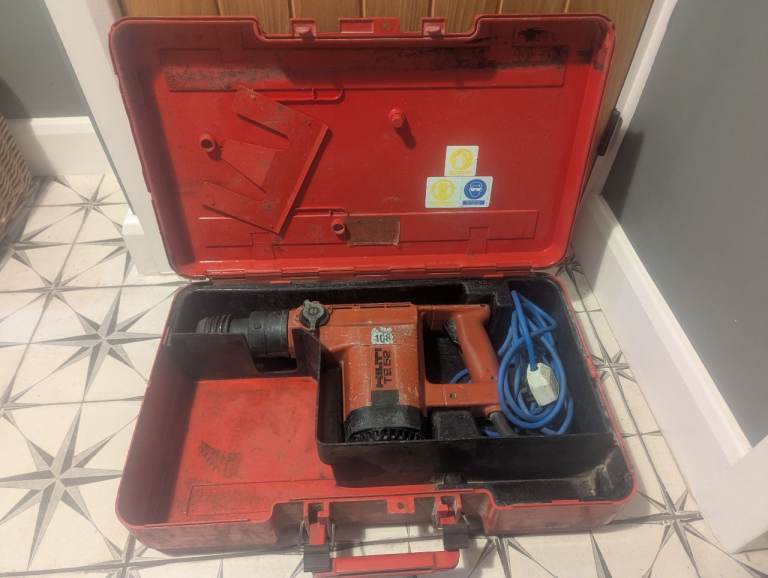 Reliable Hilti TE52 Breaker Drill comes with large drill bits  and case