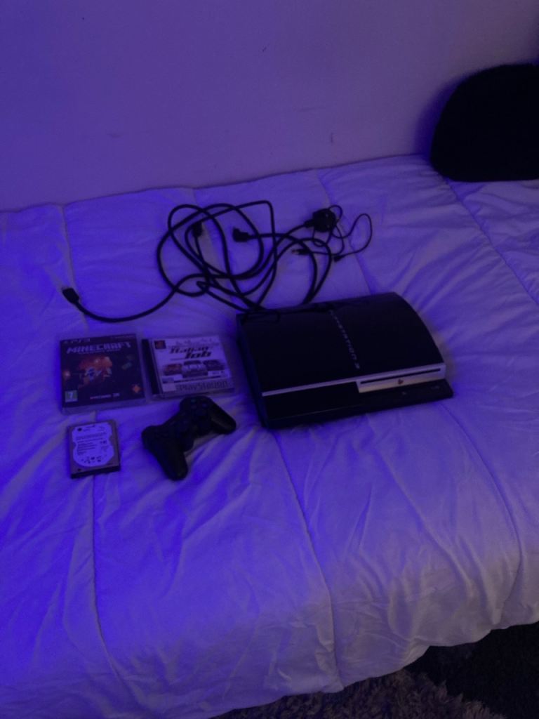 PS3 Upgraded to 1TB of storage. Comes with all the cables, 2 Games and a controller.