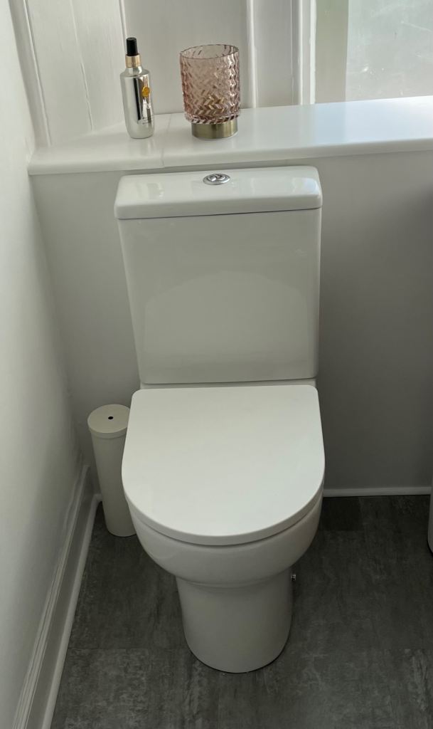 Contemporary closed couple space saving toilet 
