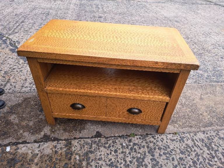 image for tv stand in light brown wood with drawer at the bottom