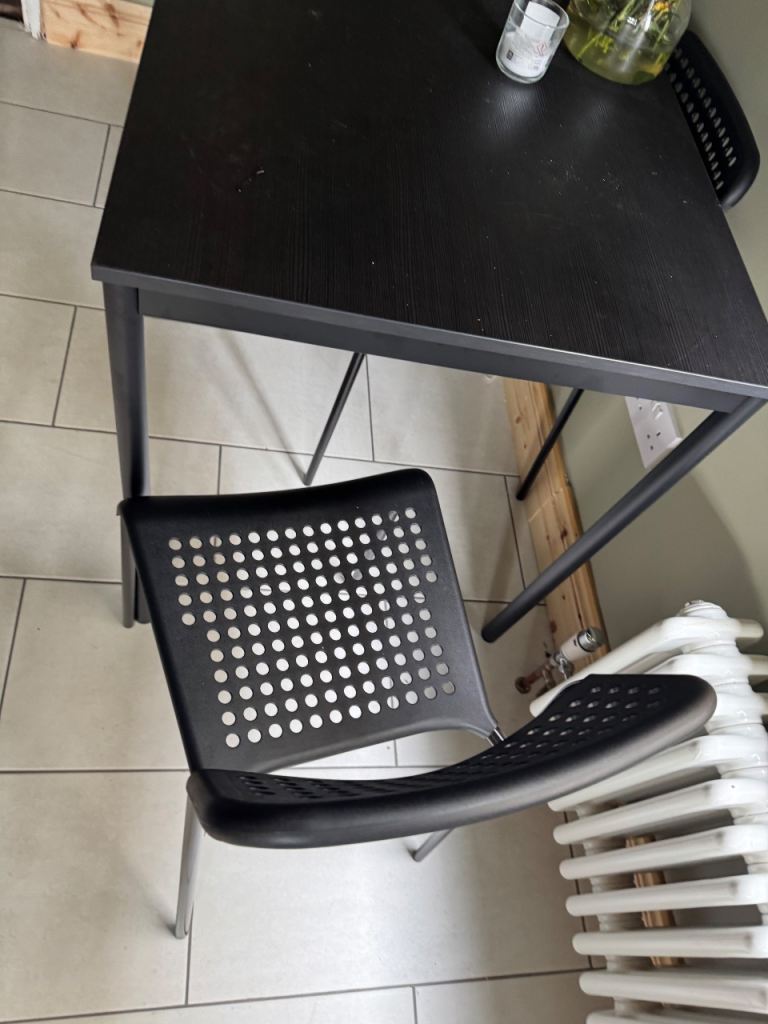 Sleek black table and chairs