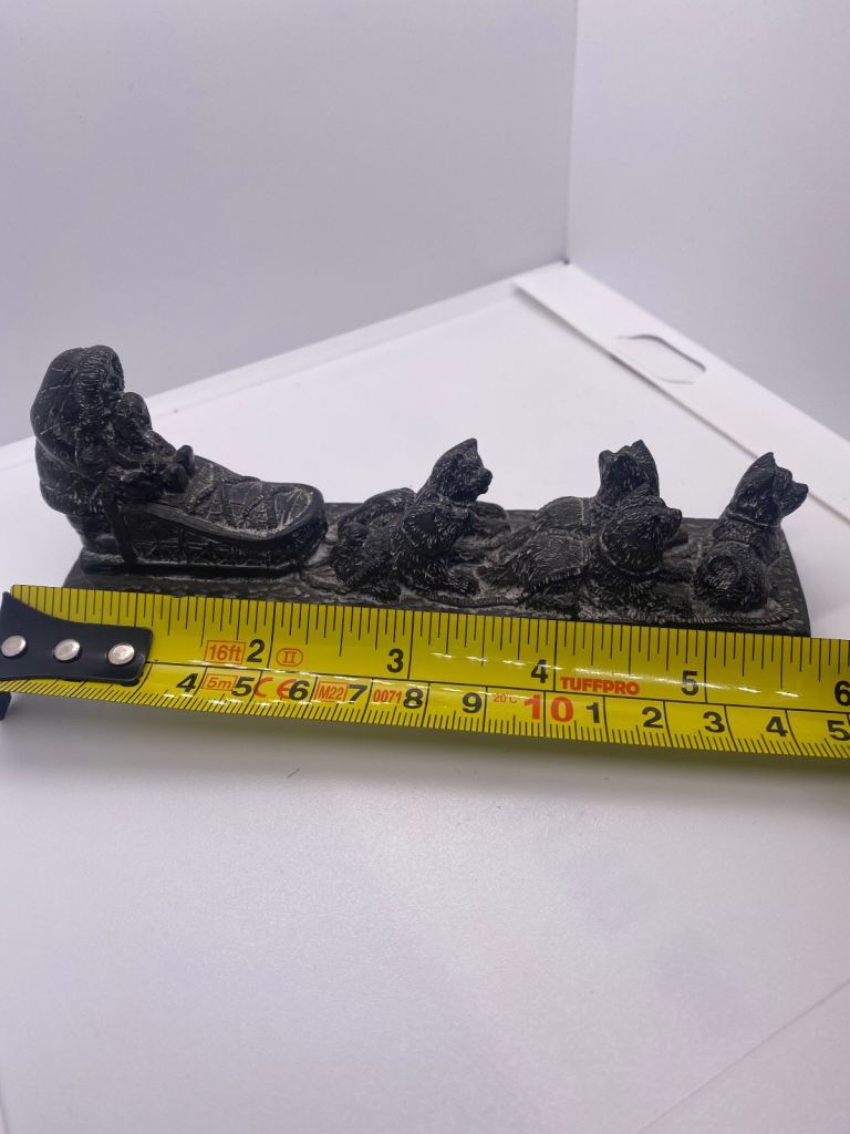 Carved Inuit sledge and dogs sculpture 