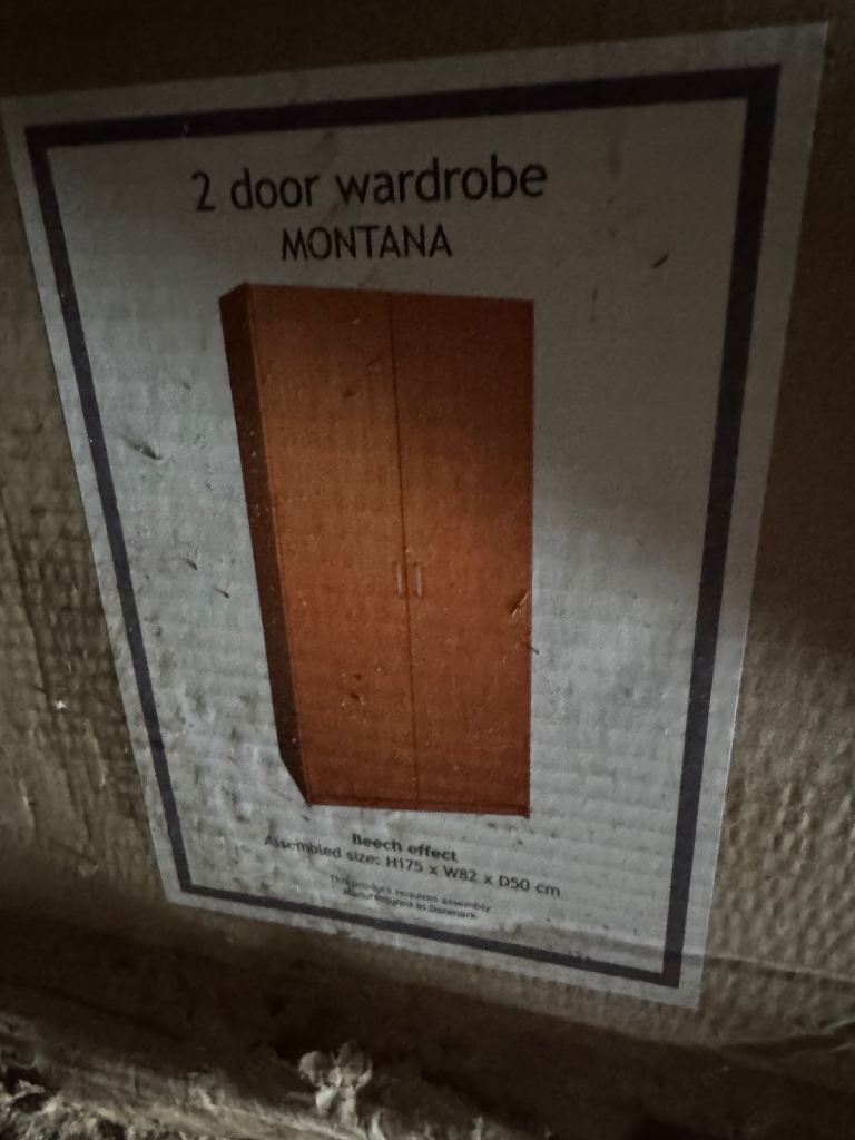 Flat pack wardrobe - some corners wet due to storage 