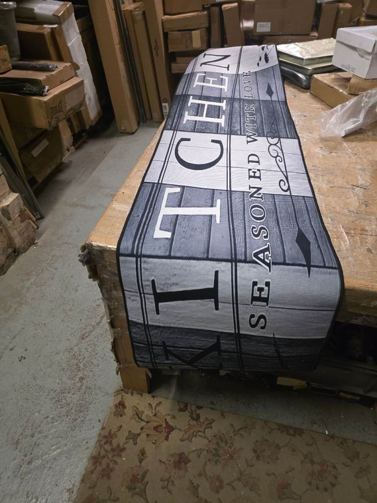A new still packed grey and black kitchen runner run the measurements are 39cms 