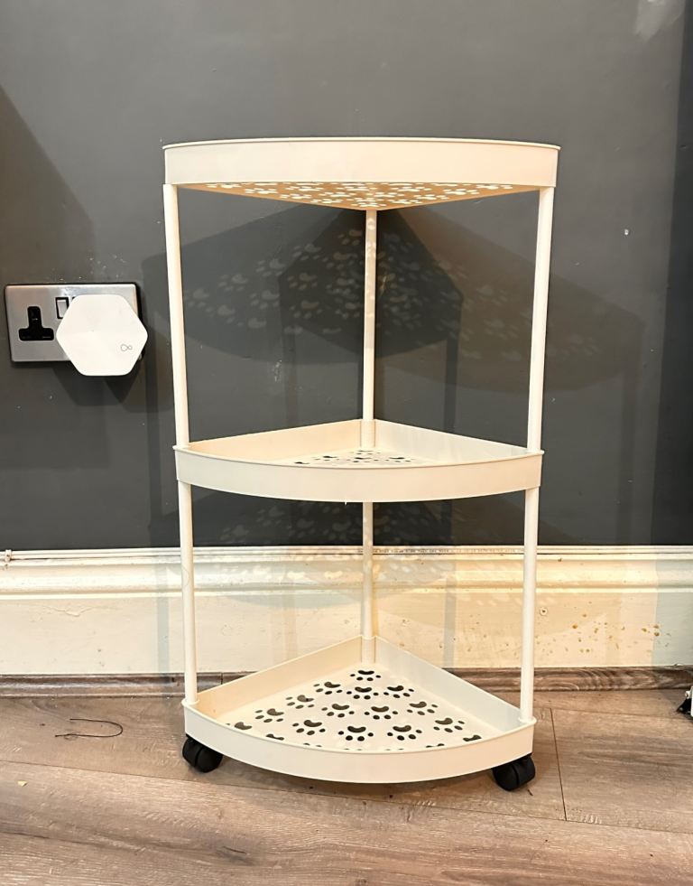 Cream Metal Corner Shelf Unit on Wheels