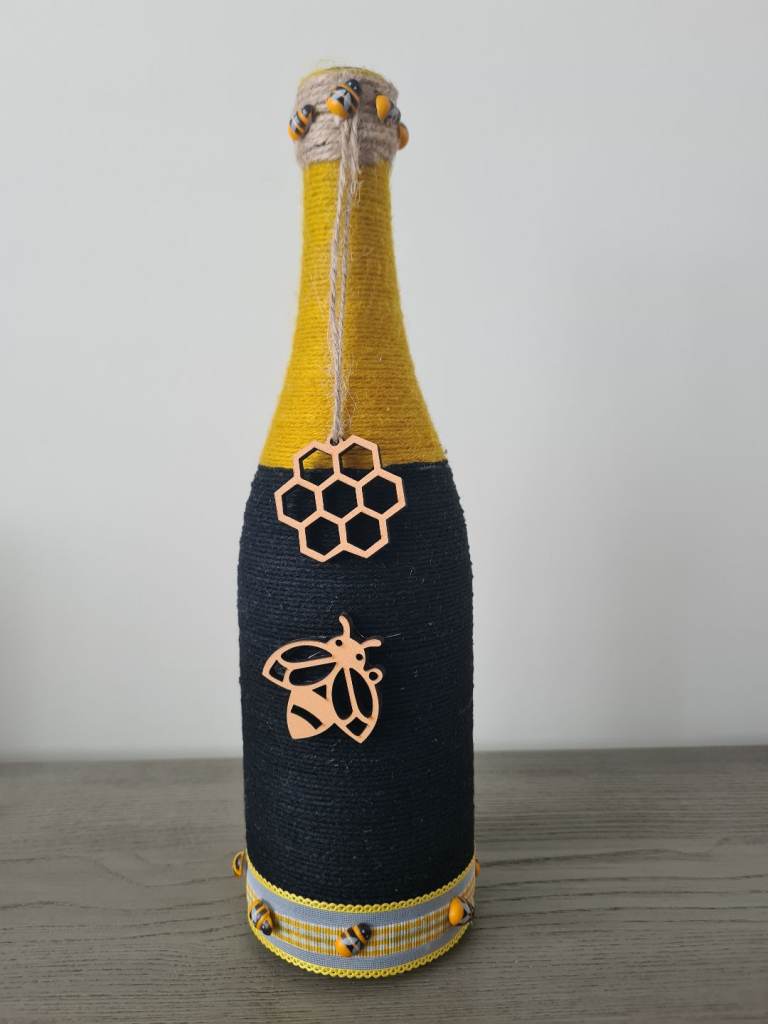 Yarn wrapped bottle ornament 