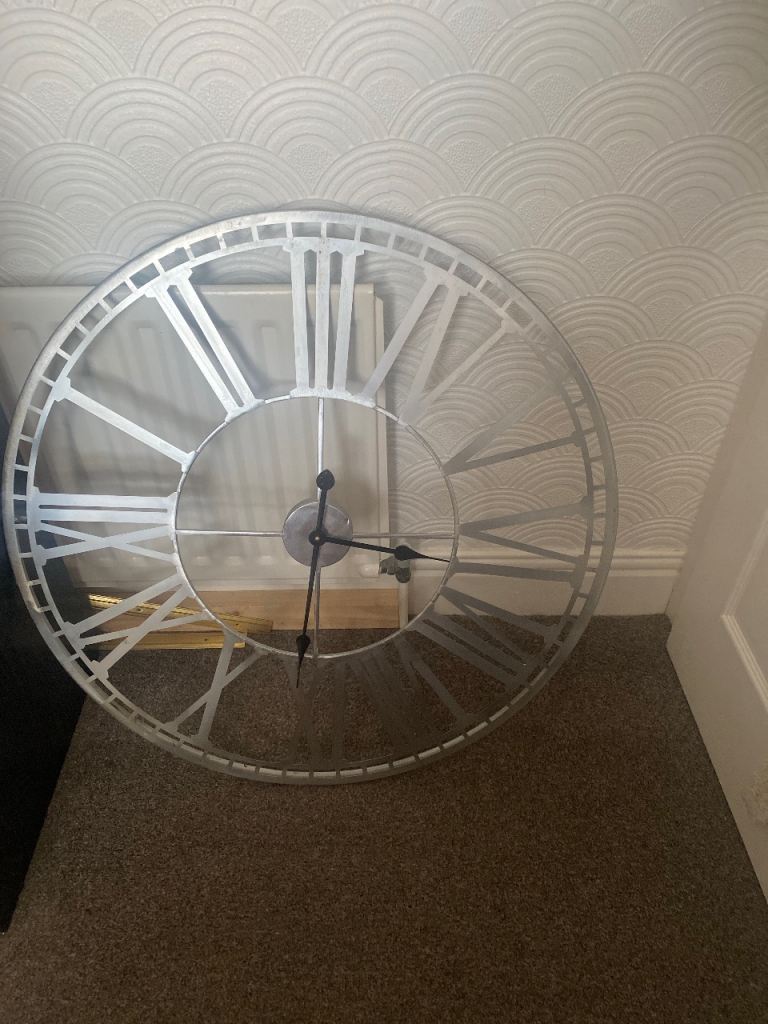 Large metal wall clock