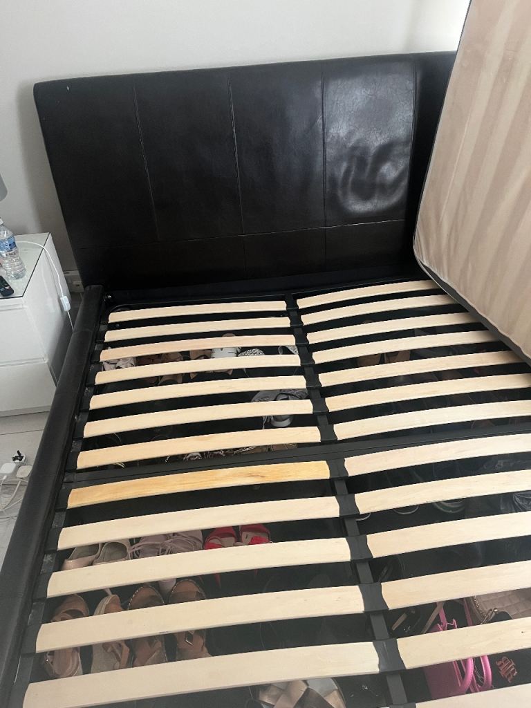 Brown leather kingsize ottoman storage bed