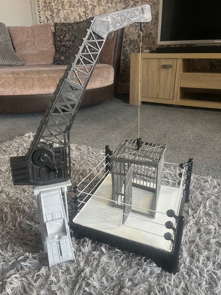 WWE Wrestling Ring, Crane & Cage Playset with 15 Action Figures