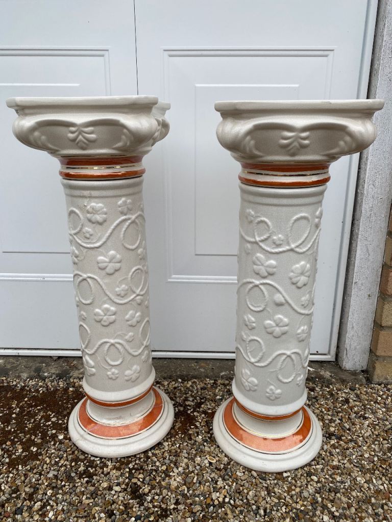 Pair of plant stands and one matching vase.