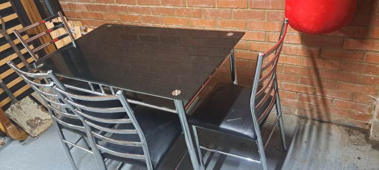 Black dinning table with 4 chairs 