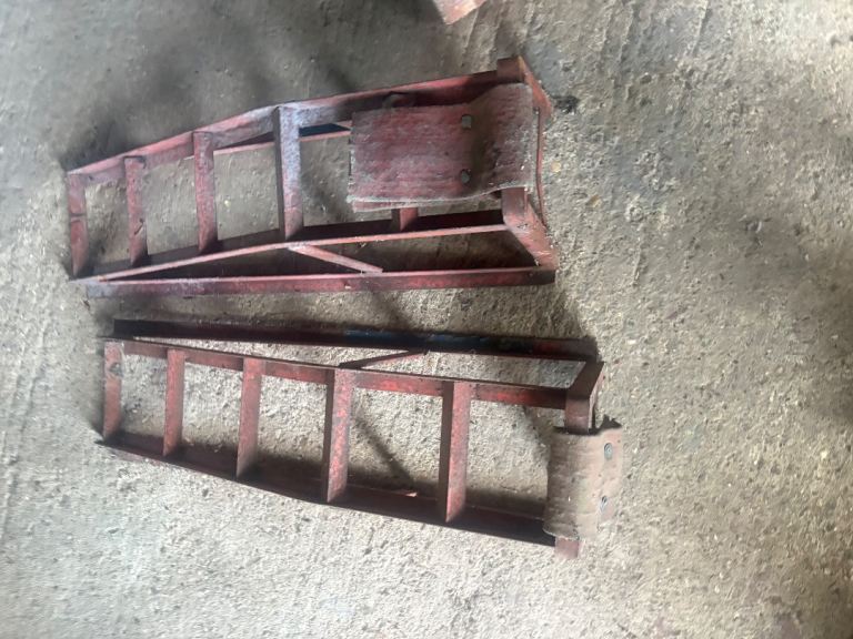 two metal car ramps 